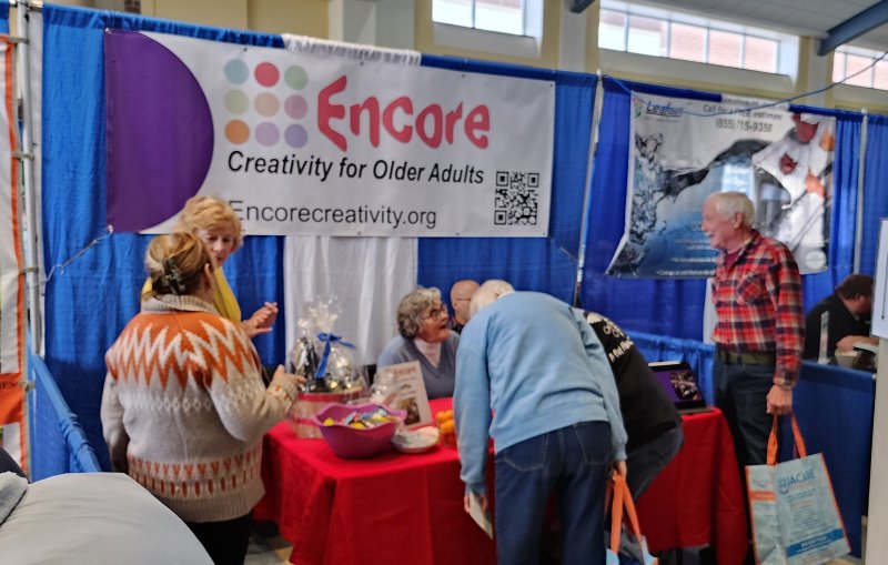 Visitors learn about the creative opportunities offered by Encore.